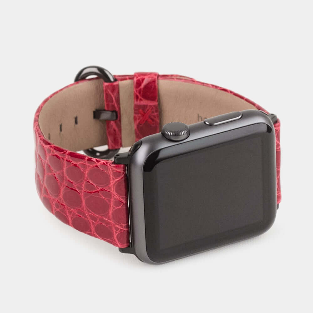 Strap for the Apple Watch 45/46 mm in red shiny alligator leather, with black adapters and buckle | 3/4 profile view to see the inner lining leather