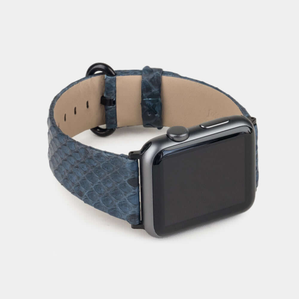 Strap for the Apple Watch 41/42 mm in blue python leather, with black adapters and buckle | 3/4 profile view to see the inner lining leather