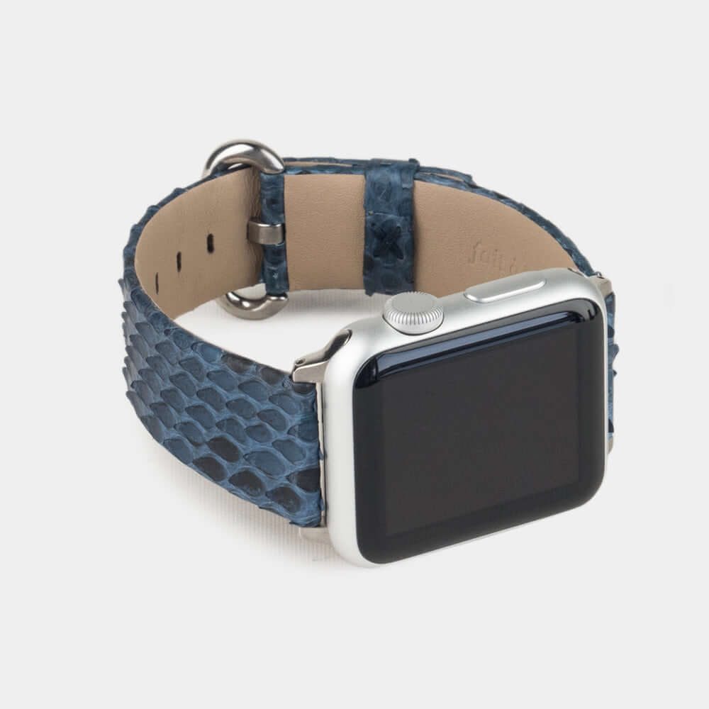 Strap for the Apple Watch 41/42 mm in blue python leather, with steel adapters and buckle | 3/4 profile view to see the inner lining leather