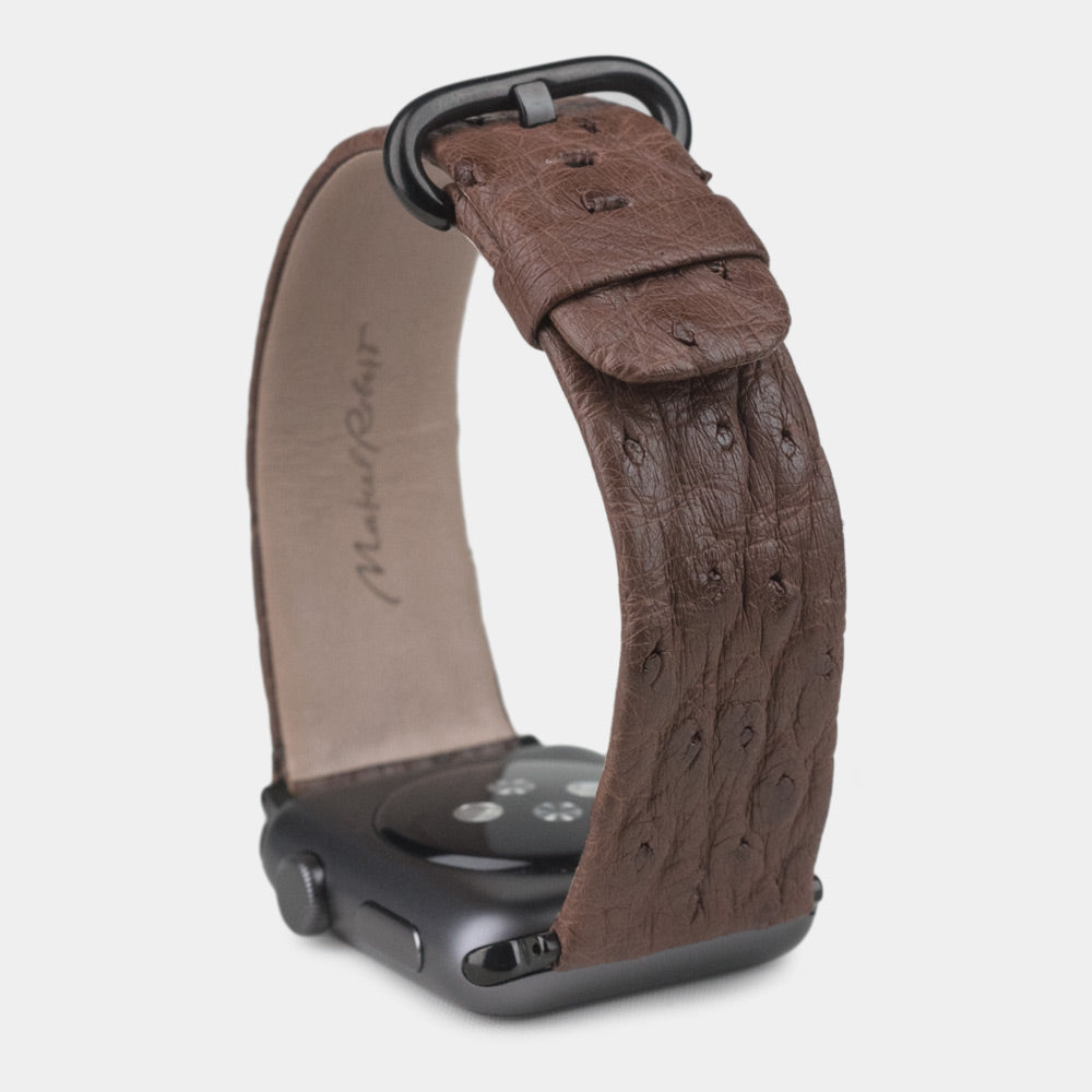 brown ostrich strap apple watch with black adapters & buckle upper view