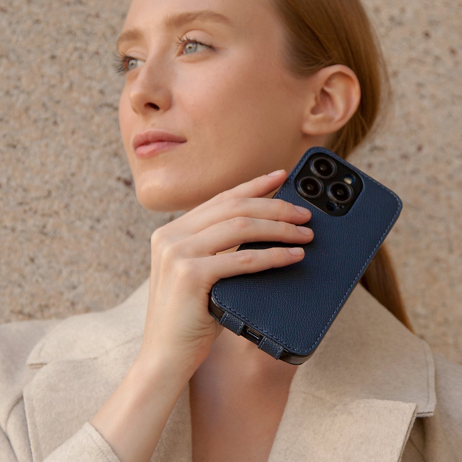 blue Calfskin leather case iPhone 15 Pro - flat side view displaying ultra-thin handcrafted design, USB-C port opening and precise edge finishing