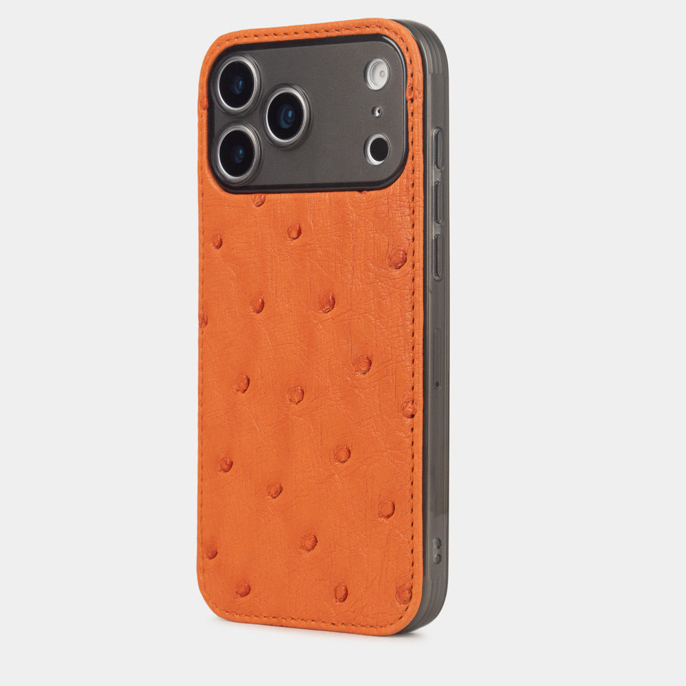 iPhone 17 Pro & Pro Max cover case in orange ostrich leather – three-quarter back view on a dark-framed iPhone, alternative angle