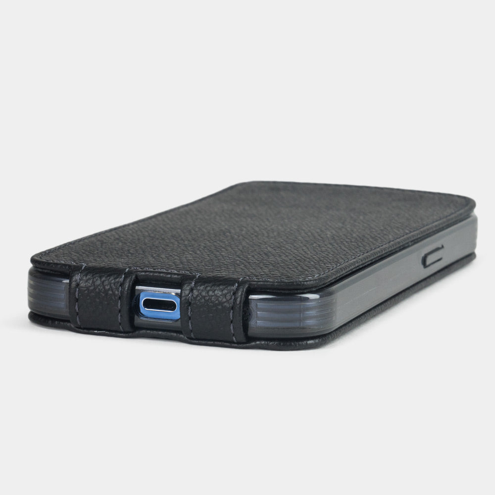 Black Epsom calfskin leather flip case for iPhone 15 Plus – bottom view with USB-C port opening and hand-stitched edges