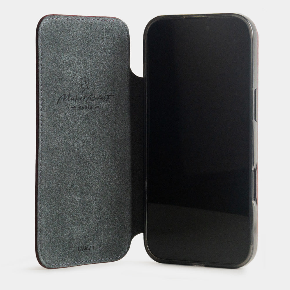 Bordeaux Calfskin Wallet Case iPhone 17 - case with grey Alcantara lining shown open on smartphone