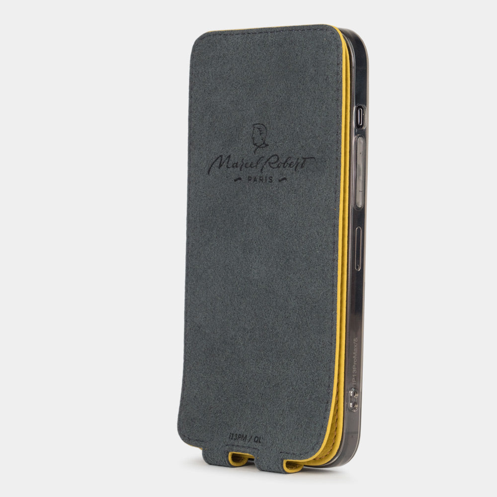 iPhone 14 Pro flip case made with yellow premium leather – flap folded onto the back of the iPhone, showing the Alcantara® fabric lining that cleans the screen