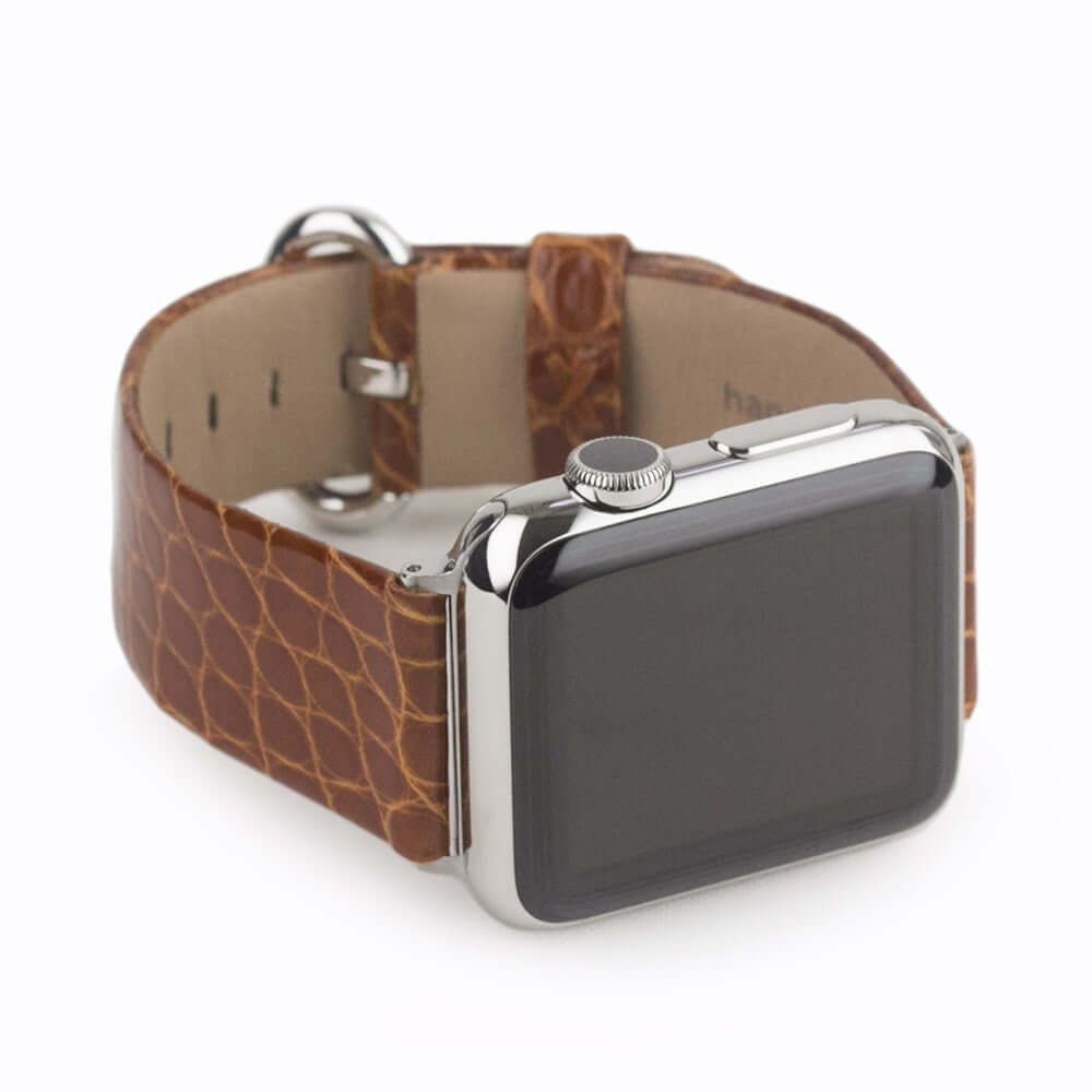 Strap for the Apple Watch 45/46 mm in Gold shiny alligator leather, with steel adapters and buckle | 3/4 profile view to see the inner lining leather