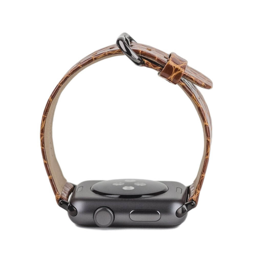 Strap for the Apple Watch 45/46 mm in Gold shiny alligator leather, with black adapters and buckle | watch case on bottom to see leather texture, inner lining and the buckle