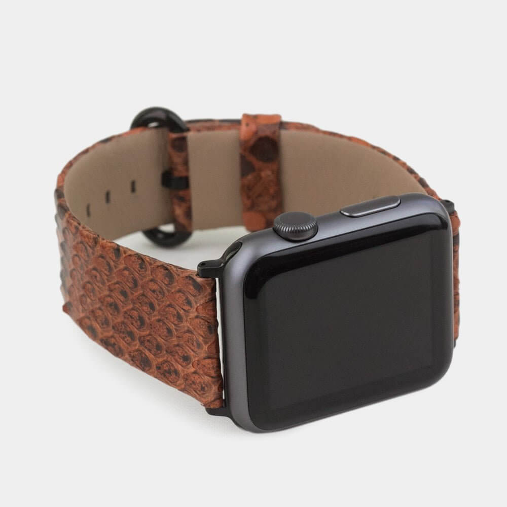 Strap for the Apple Watch 41/42 mm in Gold python leather, with black adapters and buckle | 3/4 profile view to see the inner lining leather