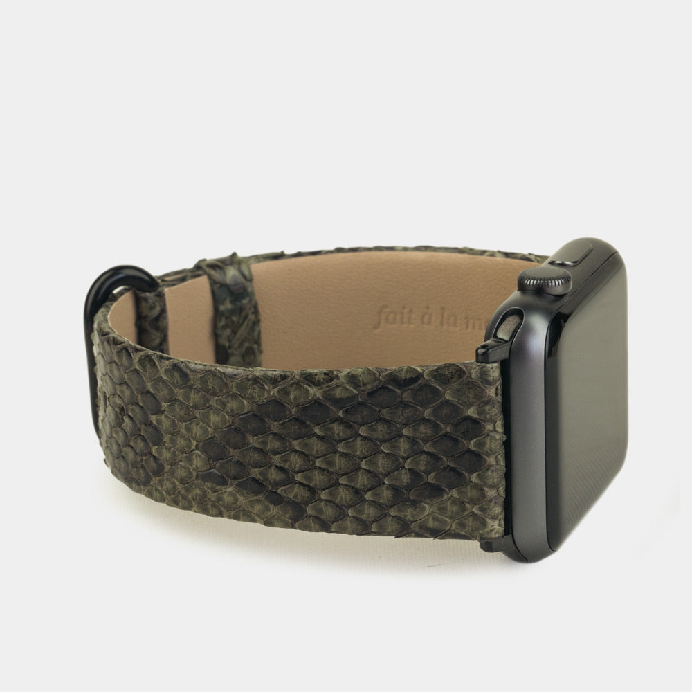 green python strap apple watch with black adapters and buckle side view