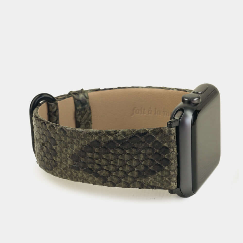 Strap for the Apple Watch 41/42 mm in green python leather, with black adapters and buckle | close-up on the inner lining leather and the brand stamp