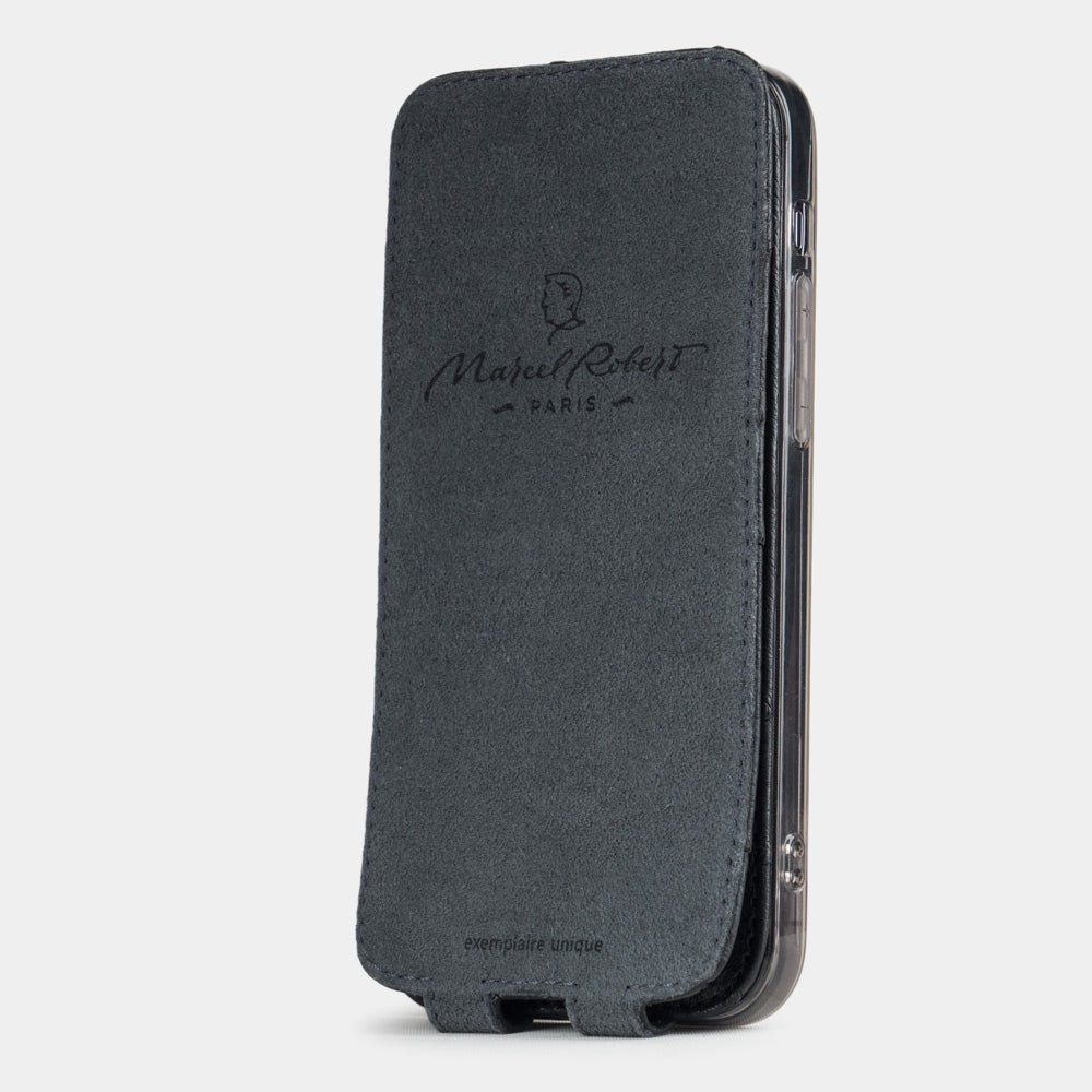 black ostrich leather flip case for iPhone 12 pro max, vertical position, cover folded and secured to the back of the iPhone thanks to its integrated magnet system, revealing the grey microfibre lining