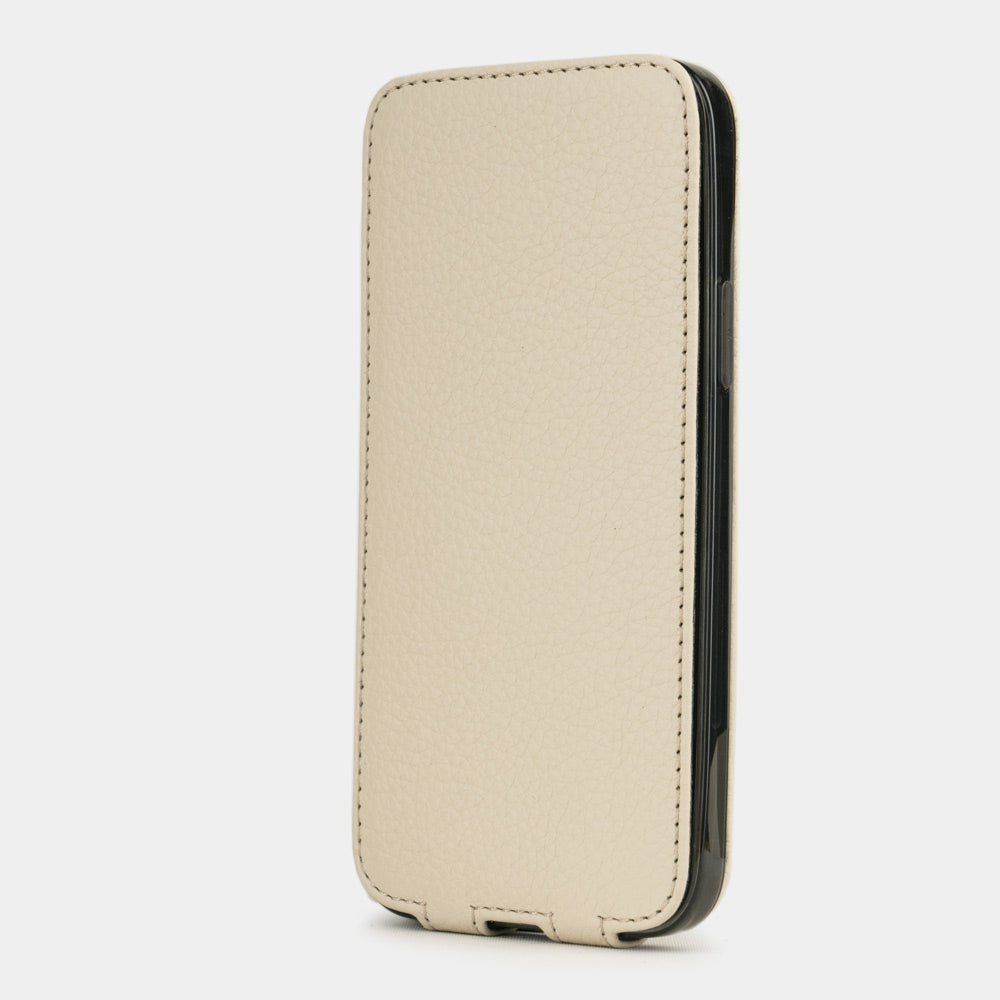 beige leather iphone 12 mini flip case in an upright position, cover closes securely thanks to its integrated magnet system