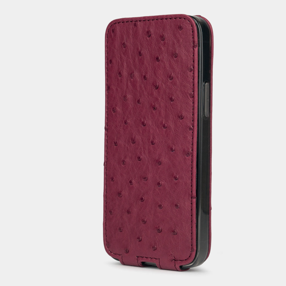 fuchsia ostrich leather iphone 12 pro max flip case in an upright position, cover closes securely thanks to its integrated magnet system