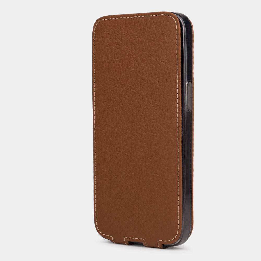gold leather iphone 13 pro max flip case in an upright position, cover closes securely thanks to its integrated magnet system