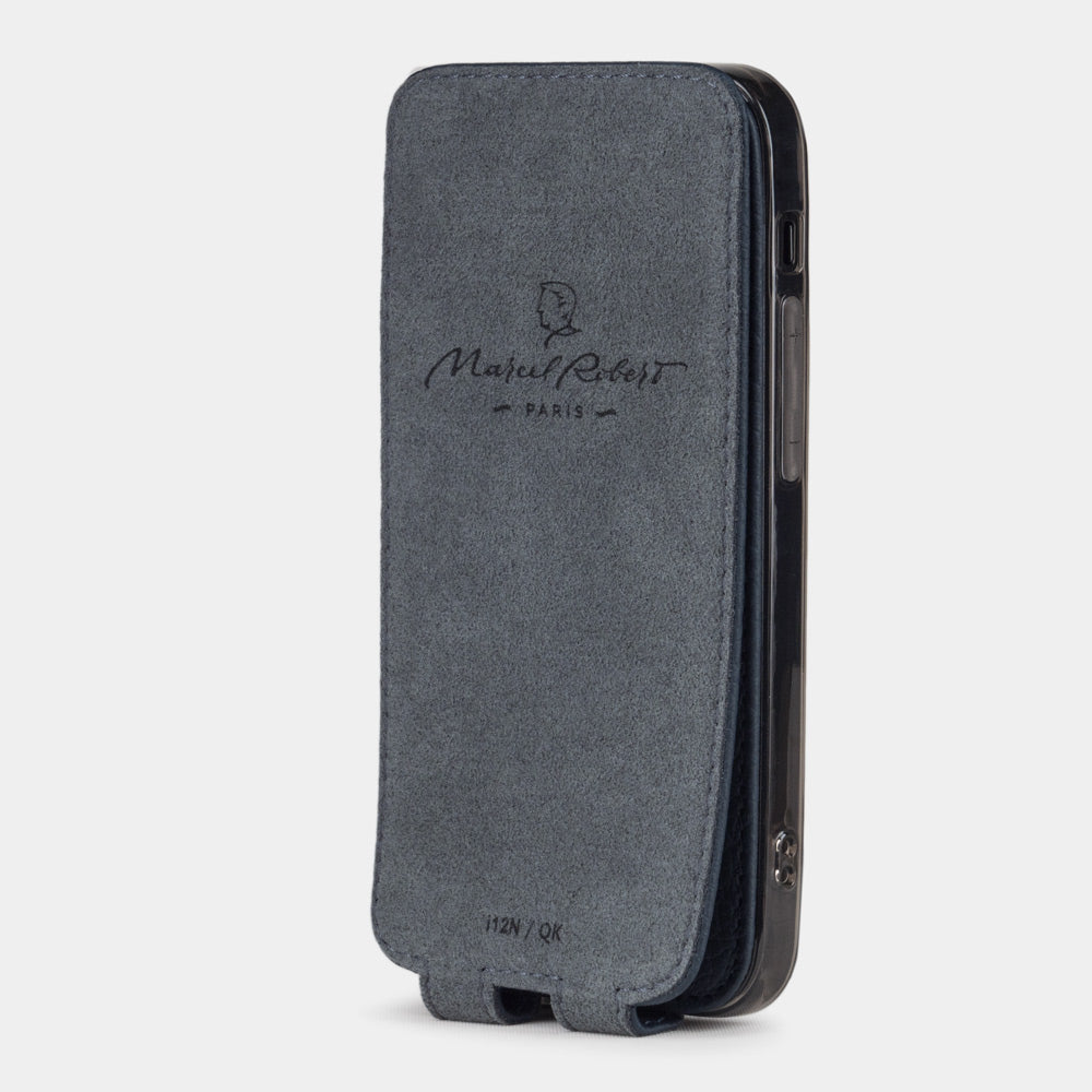 blue leather flip case for iPhone 12 pro max, vertical position, cover folded and secured to the back of the iPhone thanks to its integrated magnet system, revealing the grey microfiber lining