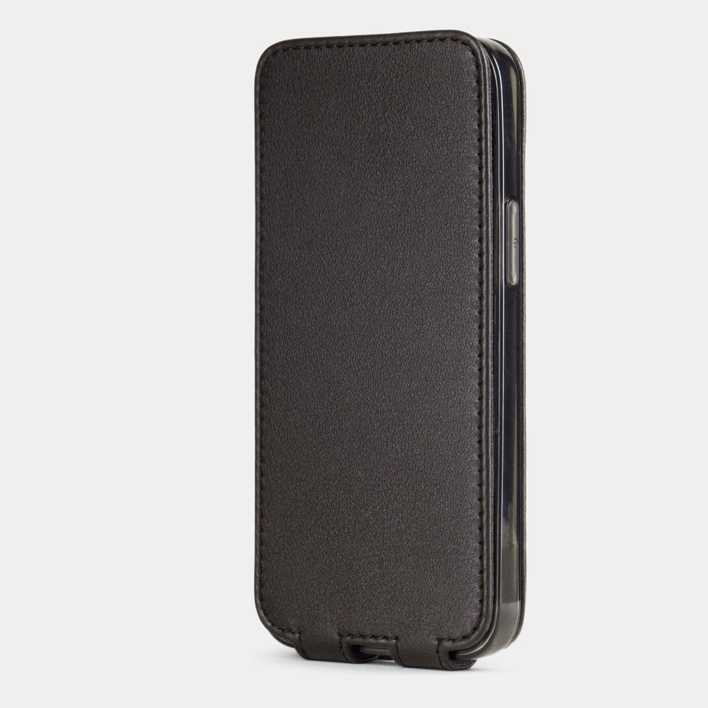 brown leather iphone 12 mini flip case in an upright position, cover closes securely thanks to its integrated magnet system