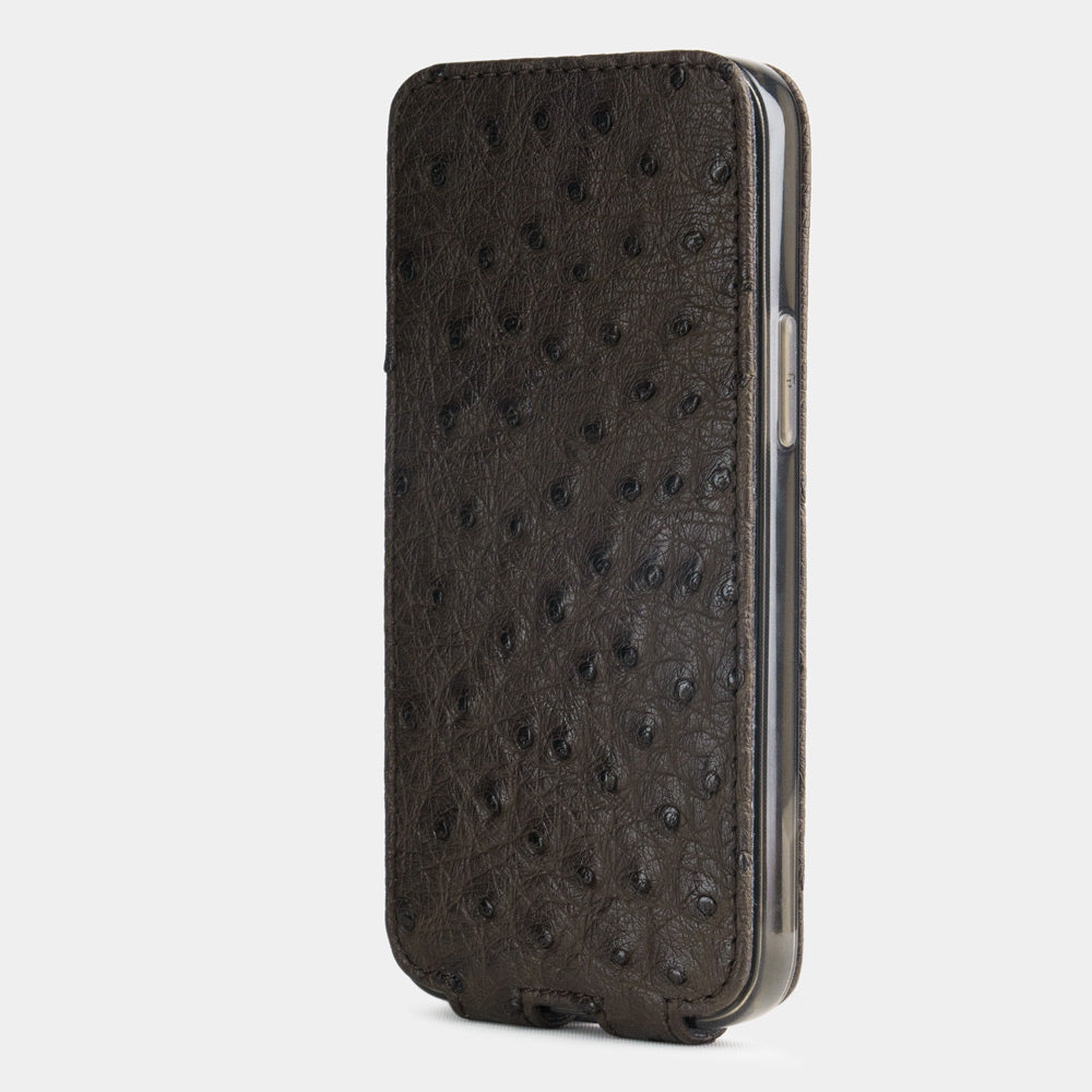 brown ostrich leather iphone 12 pro max flip case in an upright position, cover closes securely thanks to its integrated magnet system