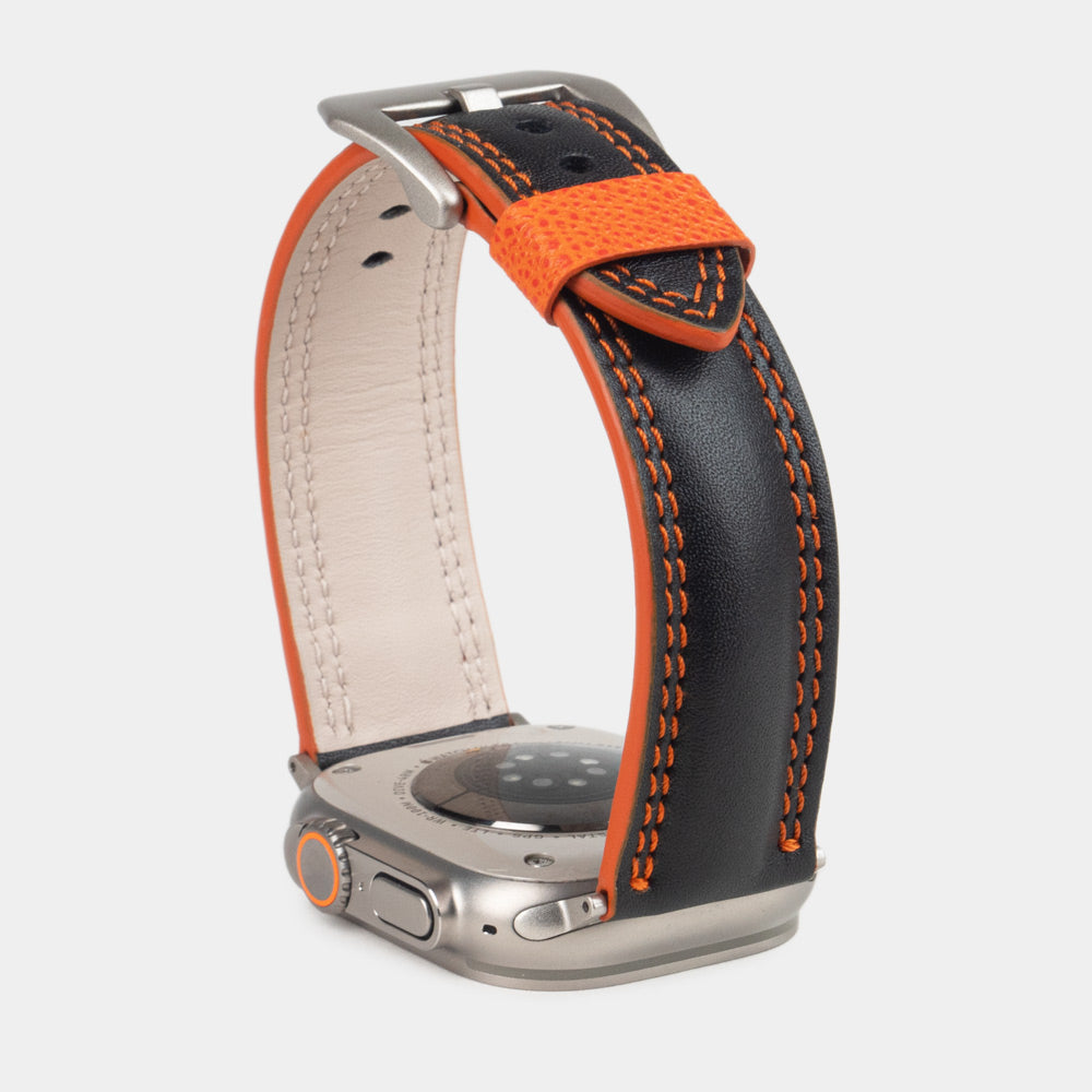 Men's Apple Watch Ultra band 49mm in black smooth calfskin leather with orange edge finish and its titanium color adapters - inside lining leather view