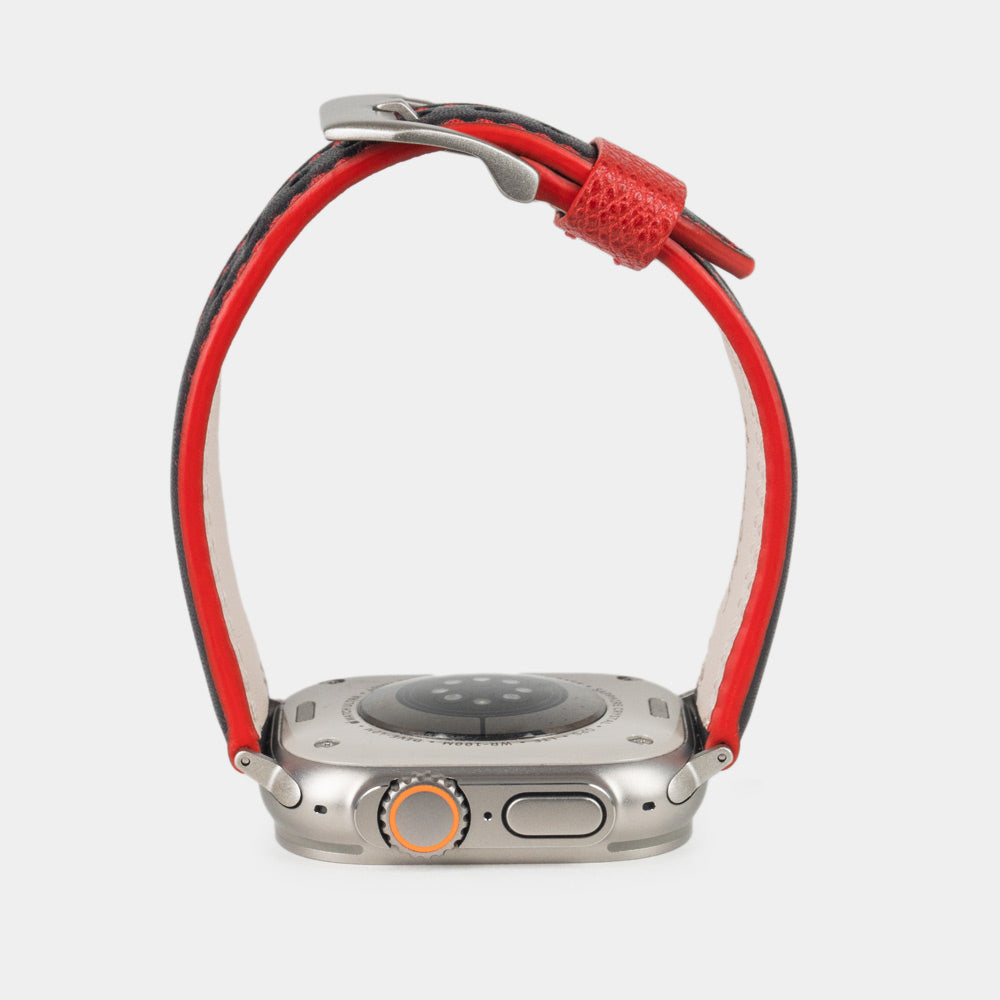 Men's Apple Watch Ultra band 49mm in black smooth calfskin leather with red edge finish and its titanium color adapters - band red color edge view