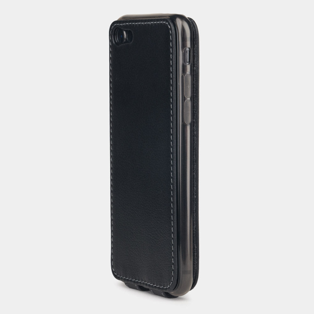 Black leather flip case for iPhone SE - flat side view displaying ultra-thin handcrafted design, Lightning port opening and precise edge finishing