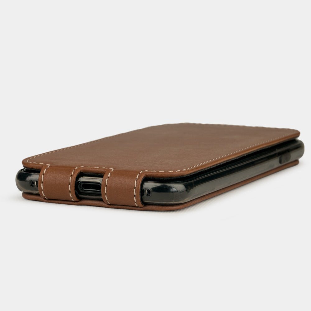 Gold leather flip case for iPhone SE - flat side view displaying ultra-thin handcrafted design, Lightning port opening and precise edge finishing