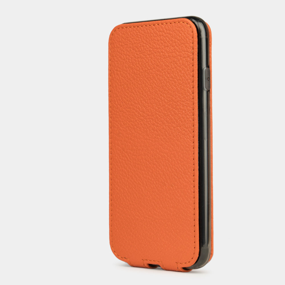 Orange leather flip case for iPhone SE - upright closed view highlighting the magnetic front cover fully protecting the screen, elegant silhouette