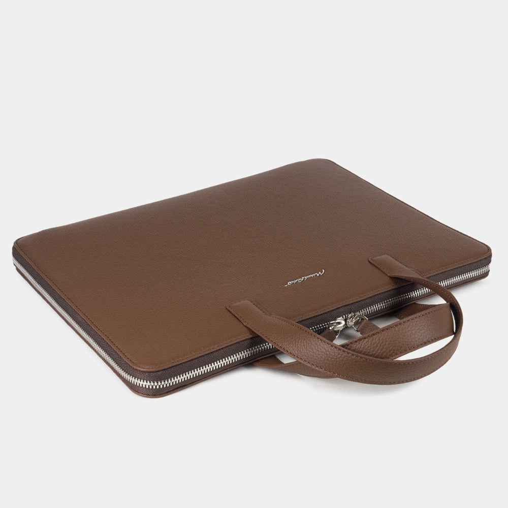 Slim 14 inch brown leather laptop bag closed, structured minimalist design