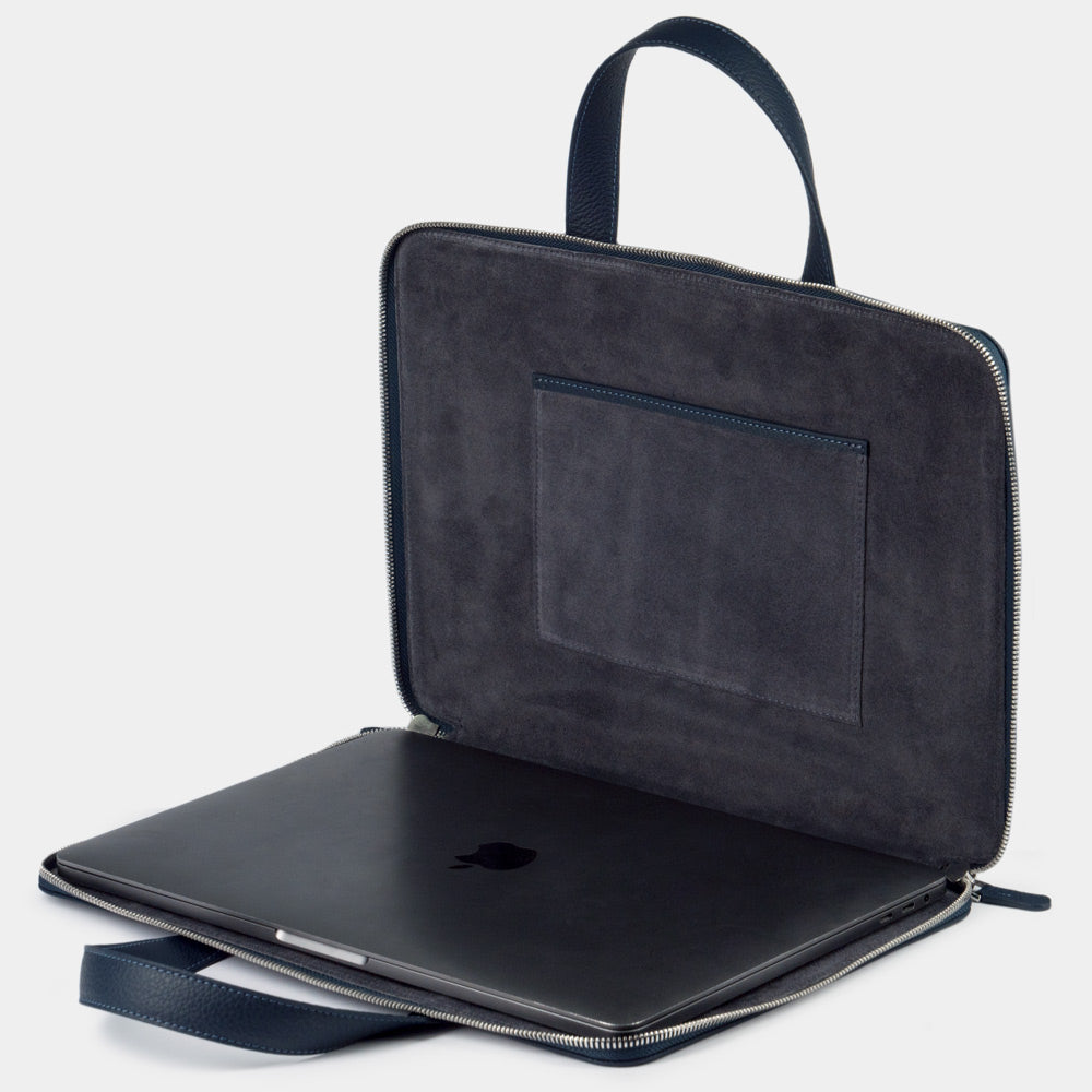 Blue 14 inch leather laptop bag with pockets open showing laptop compartment and interior lining