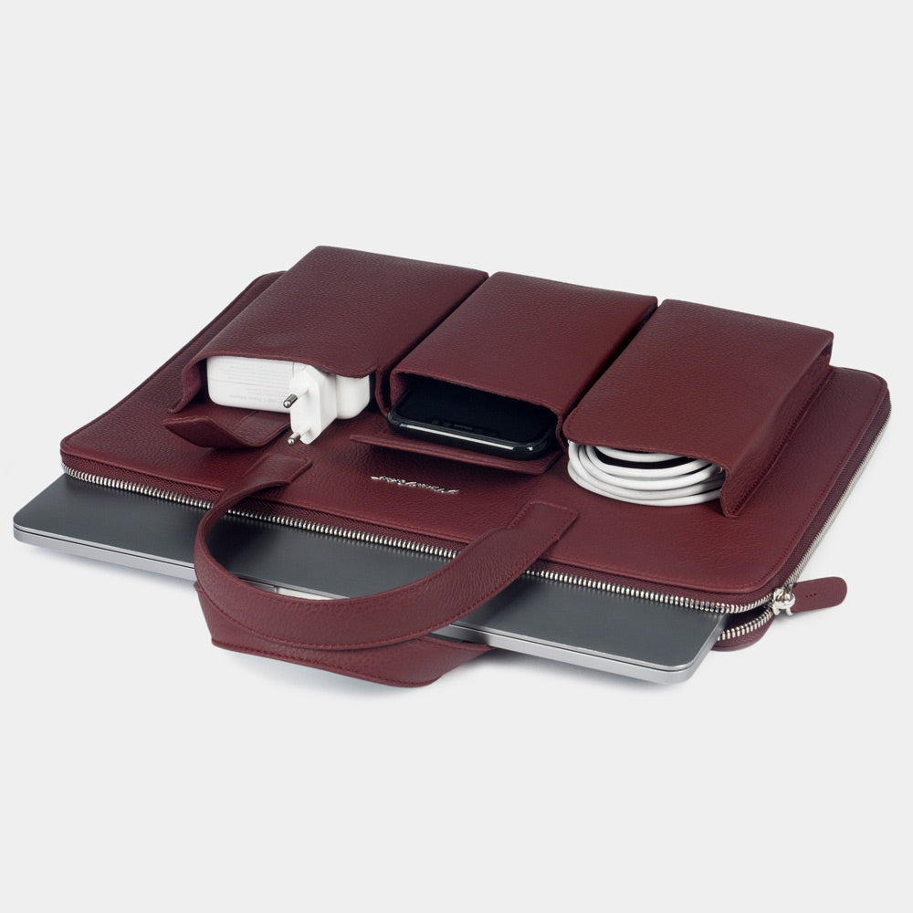 Women’s 14 inch leather laptop bag with pockets bordeaux holding laptop and documents, organized layout