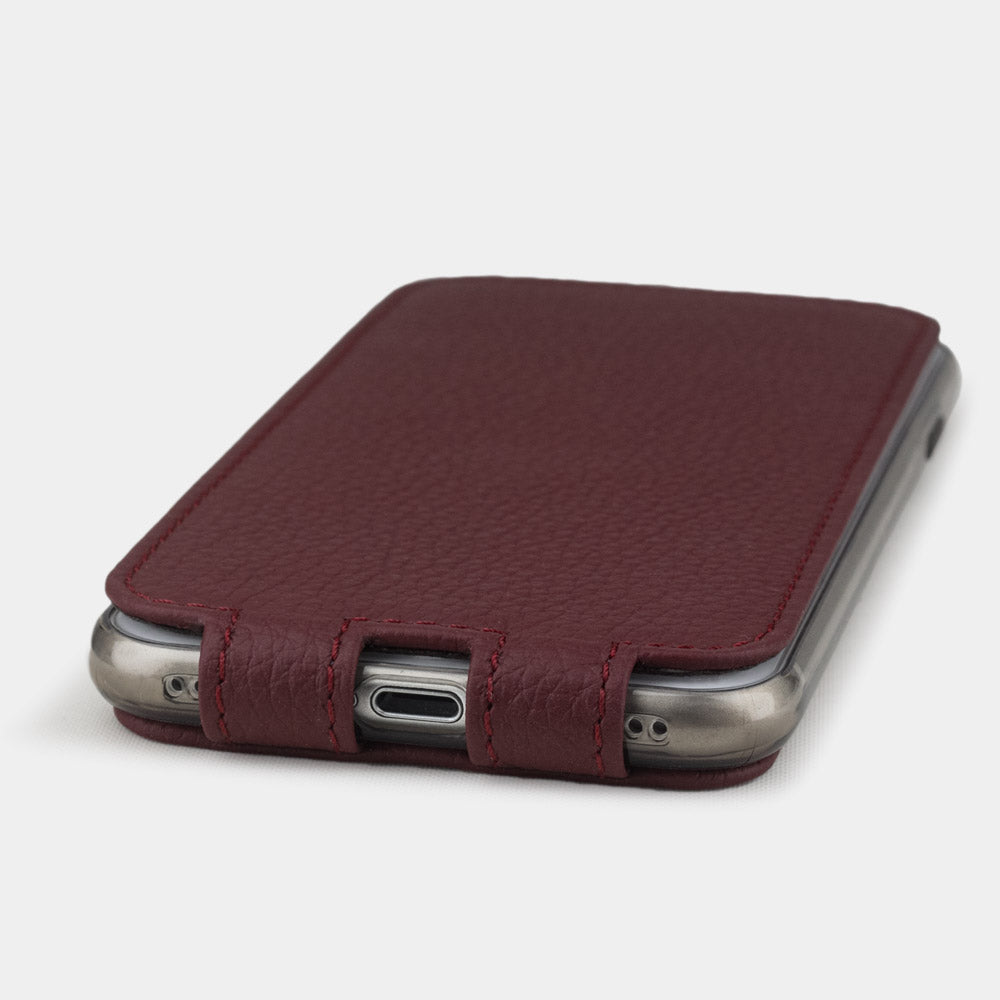 Bordeaux leather flip case for iPhone SE - flat side view displaying ultra-thin handcrafted design, Lightning port opening and precise edge finishing
