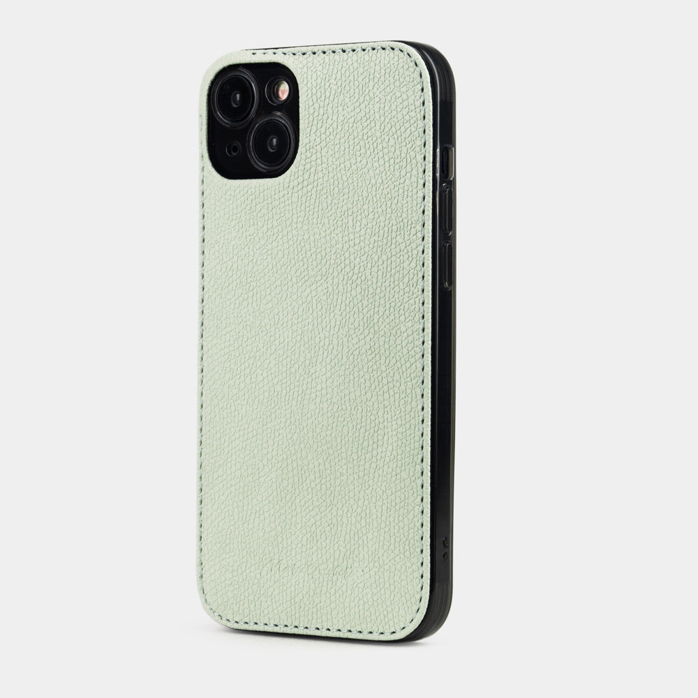 Pastel green calfskin leather cover case for iPhone 15 Plus – three-quarter back view showing the ultra-thin 2 mm profile and hand-finished edges