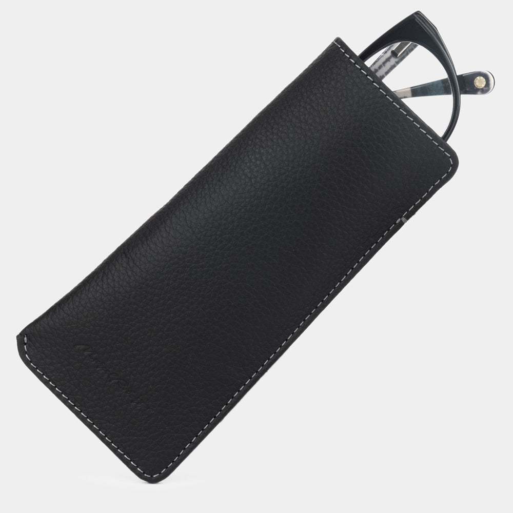 Pocket glasses pouch in black calfskin with glasses slipping out of the top