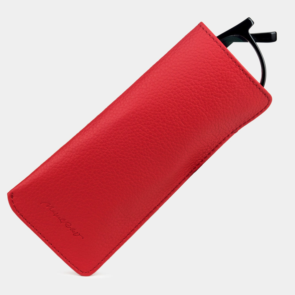 Pocket glasses pouch in red calfskin with glasses slipping out of the top