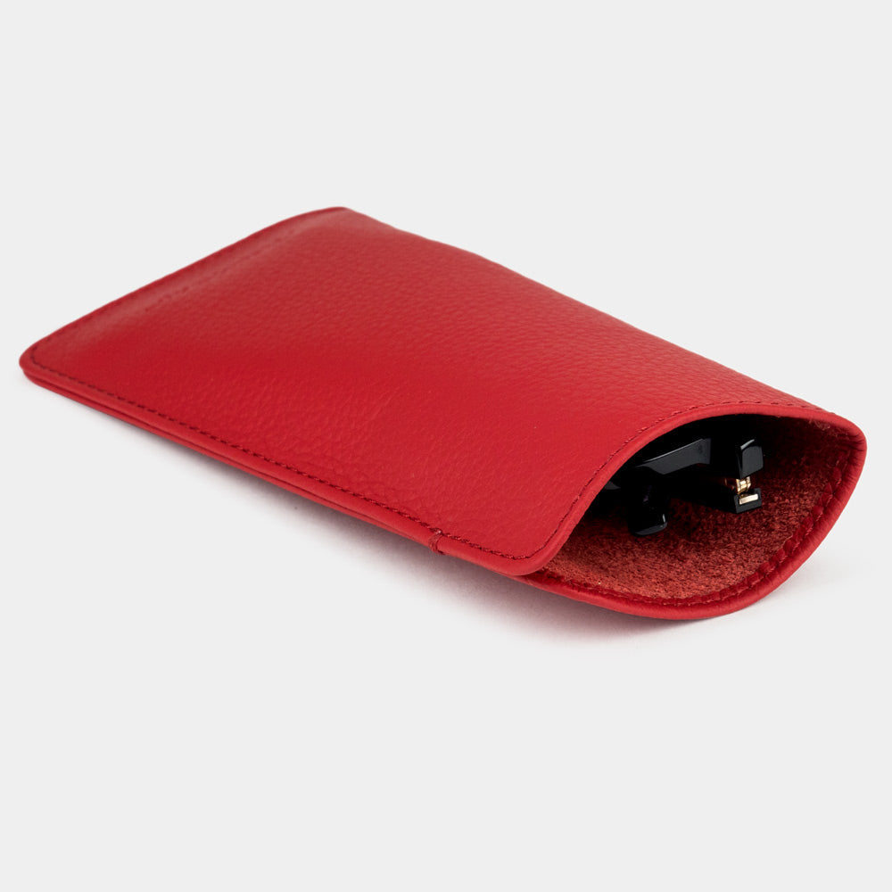 Red calfskin Pocket glasses pouch seen from the side, glasses inside