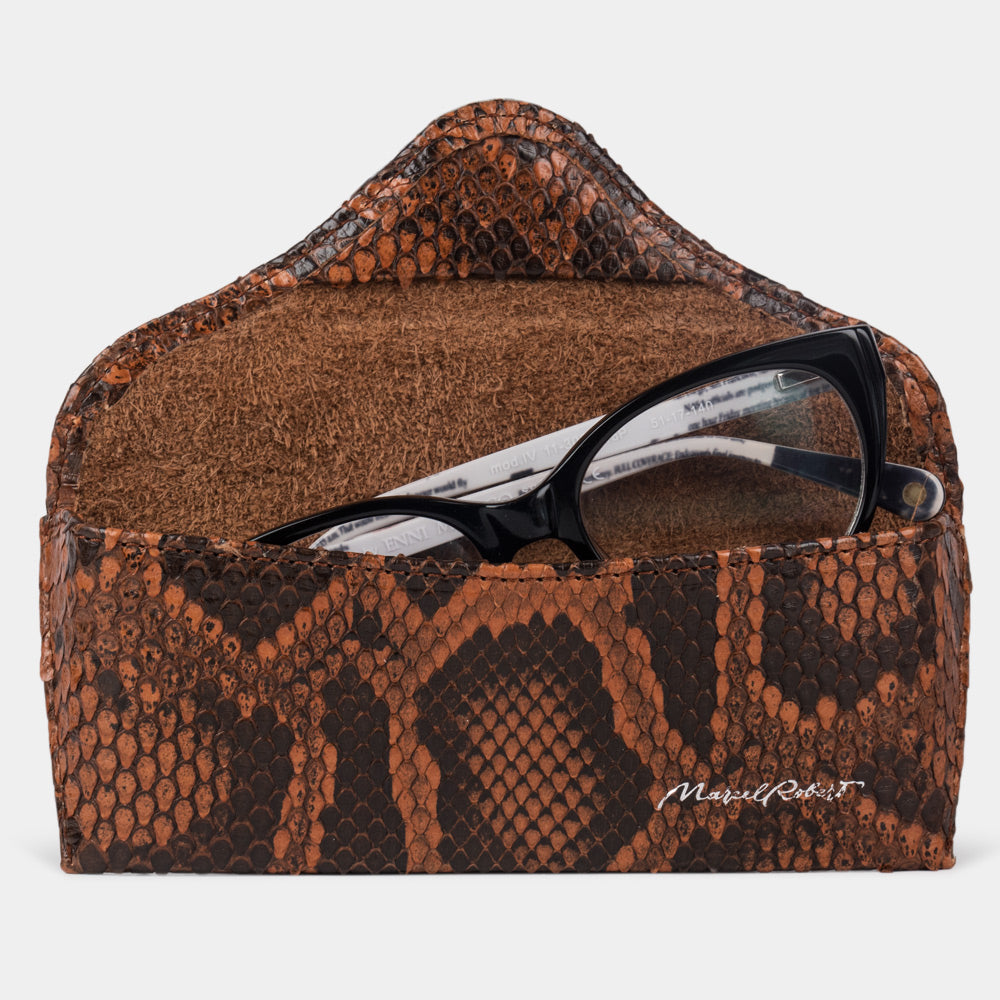 Casual glasses case in gold python leather, flap open with glasses inside