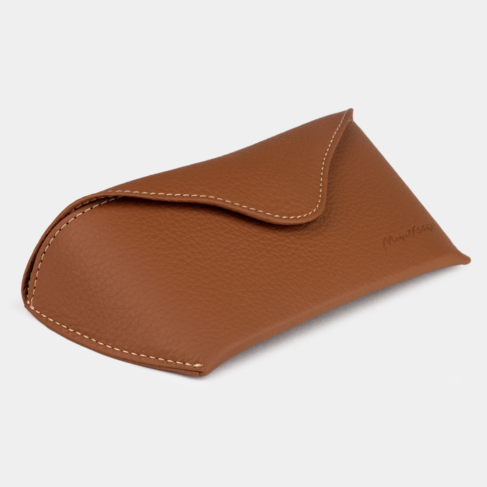 Gold calfskin Riviera sunglasses case at an angle, curved magnetic flap