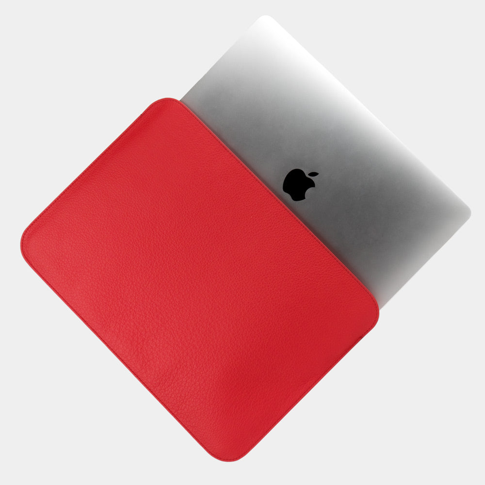 Red 14 inch leather MacBook sleeve with MacBook partially inserted, slim elegant laptop case for women