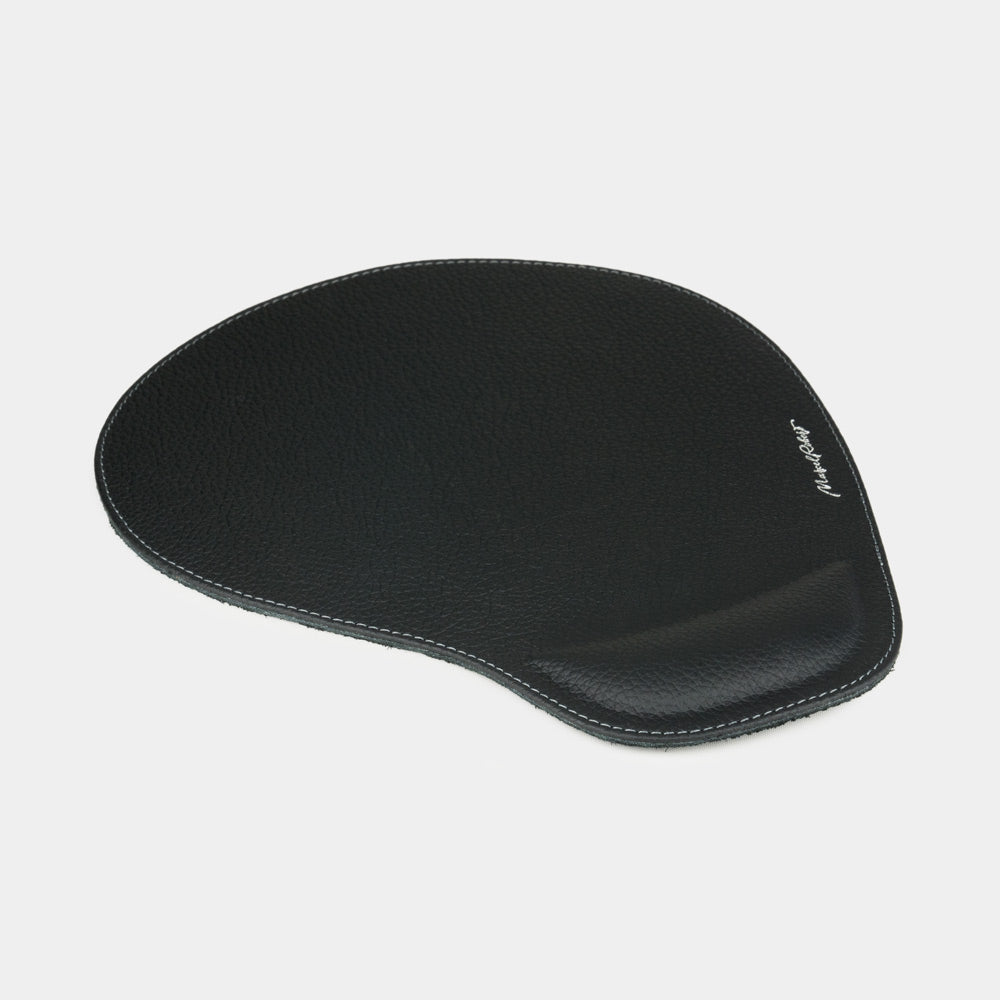 Black leather mouse pad, side view of the padded wrist rest and stitched edge