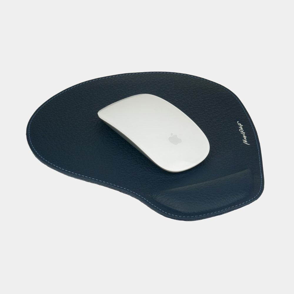 Blue leather mouse pad with wrist rest, white mouse on grained calfskin