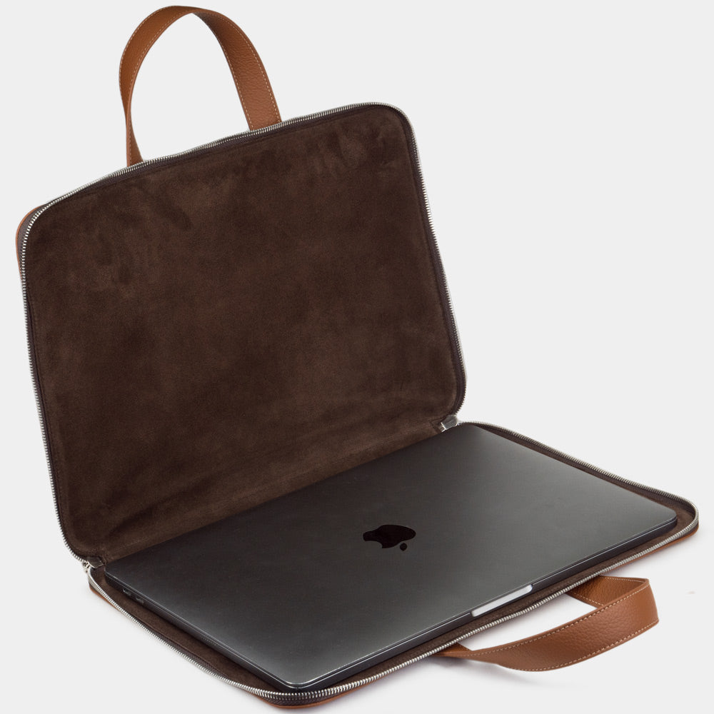 17 inch gold leather laptop bag with pockets open showing laptop compartment and interior lining