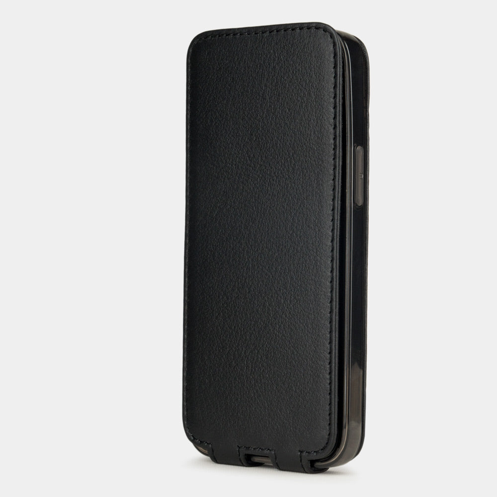 black leather iphone 12 mini flip case in an upright position, cover closes securely thanks to its integrated magnet system