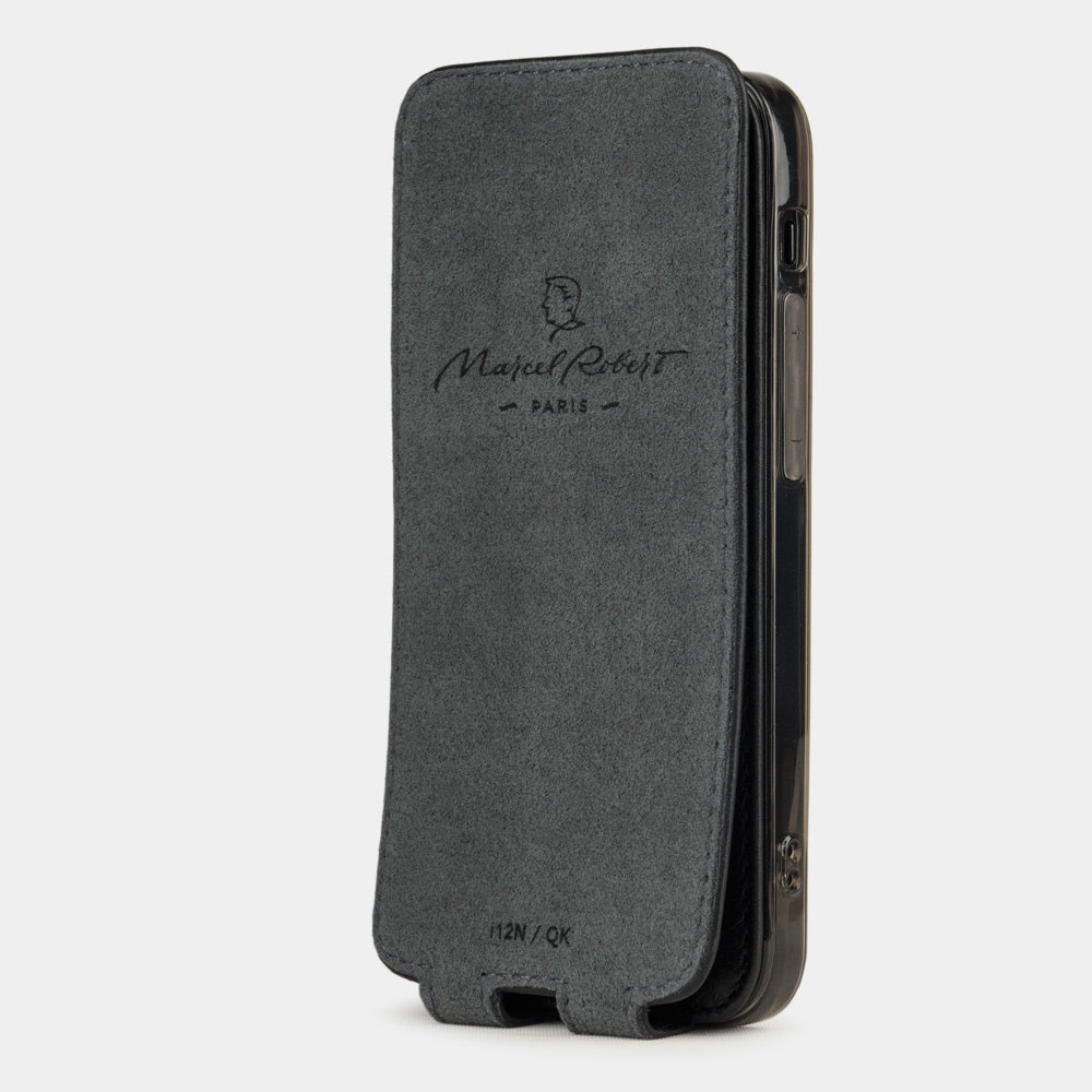black leather flip case for iPhone 12 mini, vertical position, cover folded and secured to the back of the iPhone thanks to its integrated magnet system, revealing the grey microfibre lining