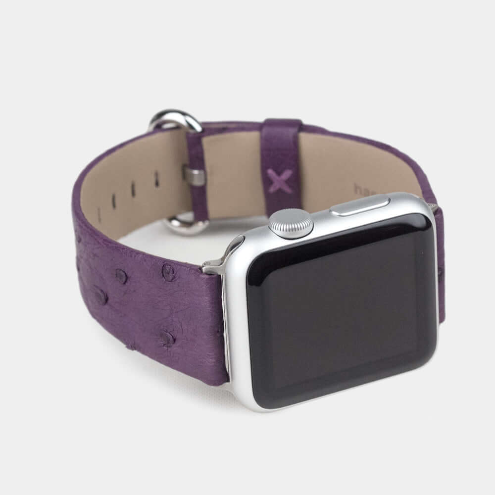 Strap for the Apple Watch 41/42 mm in purple ostrich leather, with steel adapters and buckle | close-up on the inner lining leather and the brand stamp