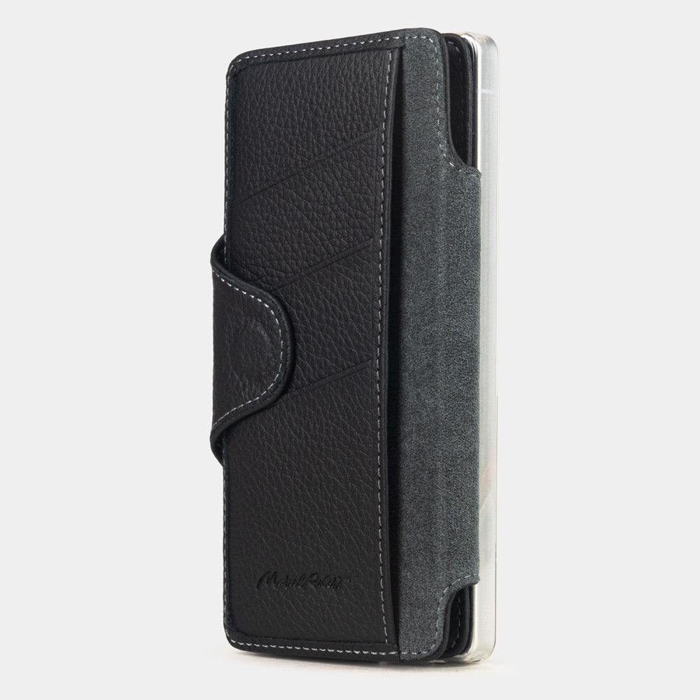 black leather Samsung S26 Ultra flip case with magnetic closure, cover folded to the back of the smartphone revealing the interior