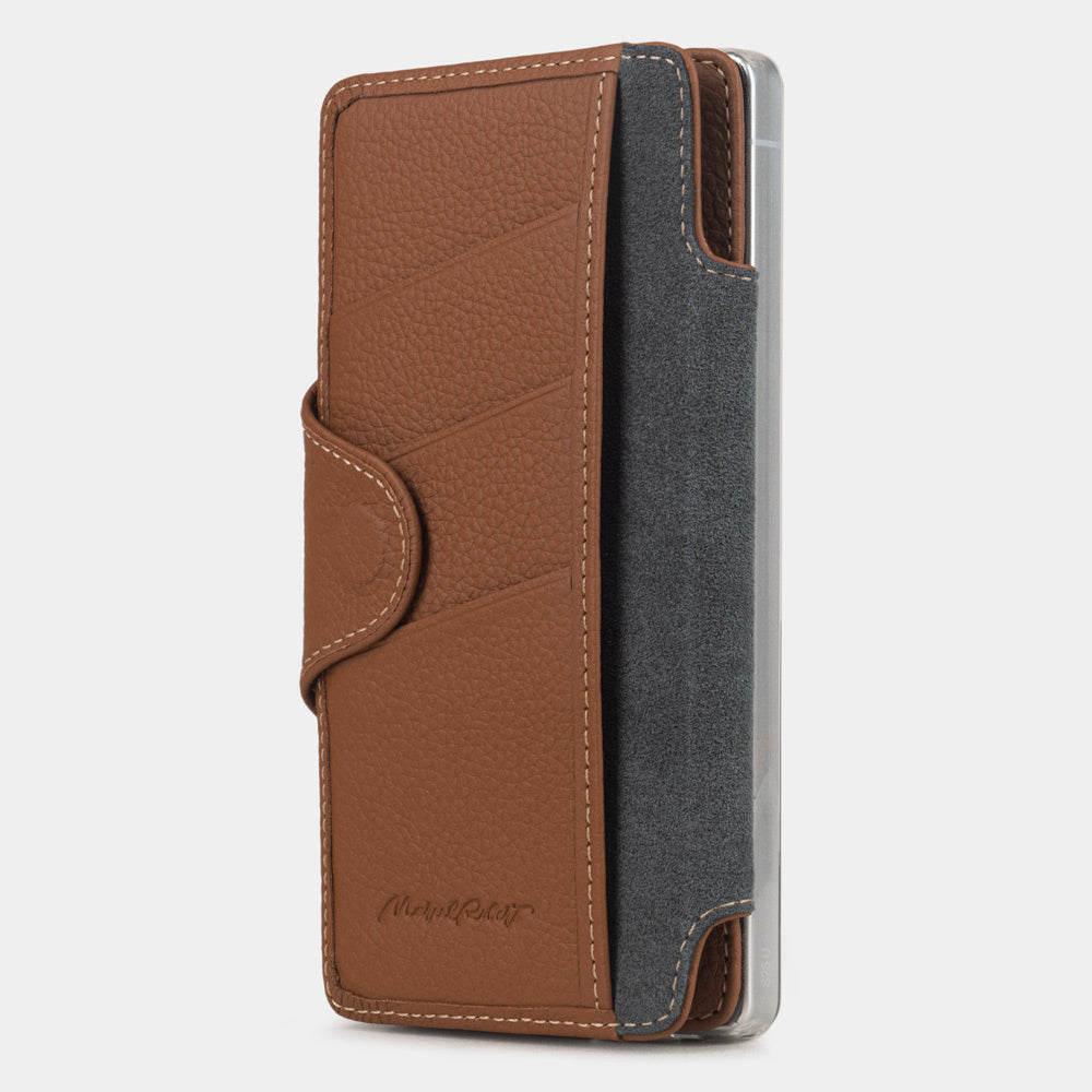 gold leather Samsung S26 Ultra flip case with magnetic closure, cover folded to the back of the smartphone revealing the interior