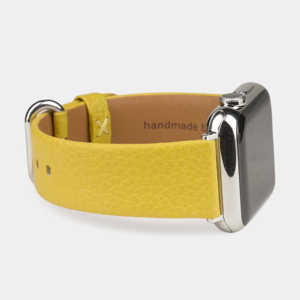 Strap for the Apple Watch 41/42 mm in yellow soft grained calfskin leather, with steel adapters and buckle | close-up on the inner lining leather and the brand stamp