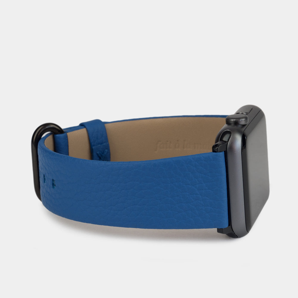 Strap for the Apple Watch 41/42 mm in royal blue soft grained calfskin leather, with black adapters and buckle | 3/4 profile view to see the inner lining leather