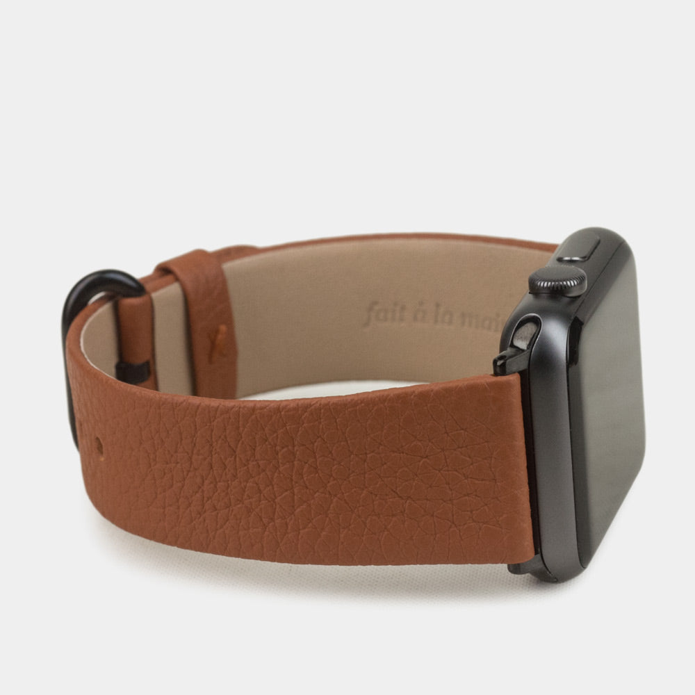 Strap for the Apple Watch 41/42 mm in Gold soft grained calfskin leather, with black adapters and buckle | 3/4 profile view to see the inner lining leather