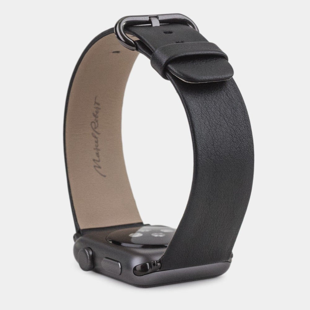 Strap for the Apple Watch 45/46 mm in black smooth calfskin leather, with black adapters and buckle | watch case on bottom to see leather texture, inner lining and the buckle