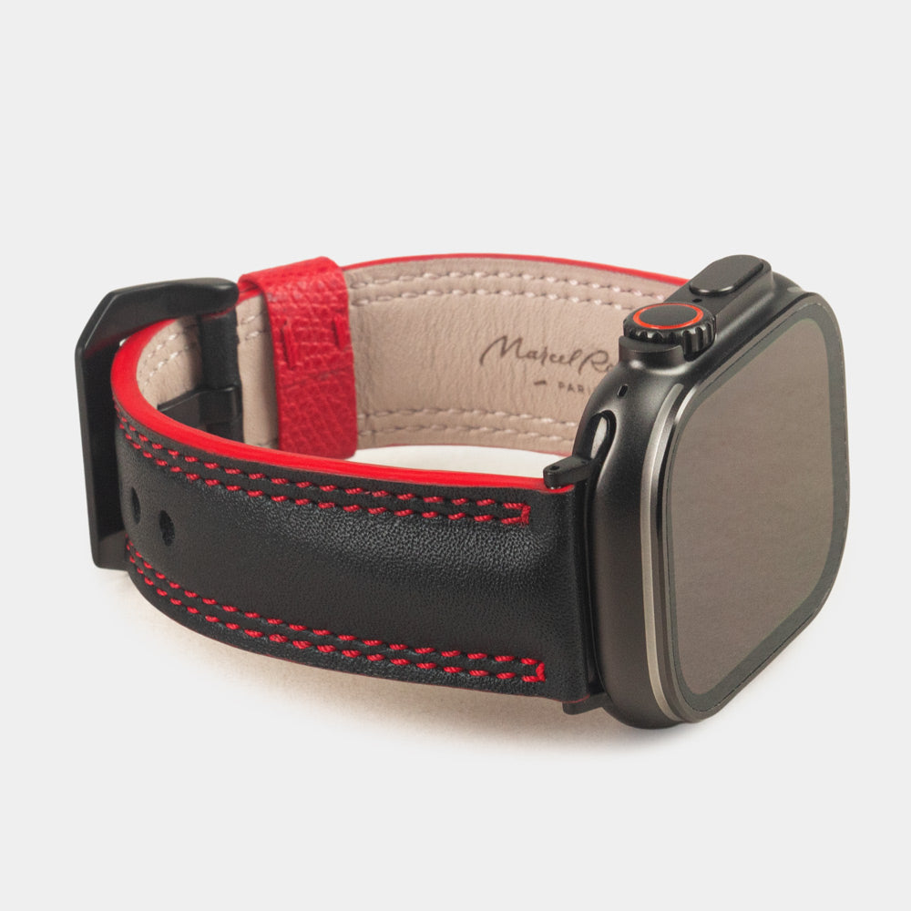 Men's Apple Watch Ultra band 49mm in black smooth calfskin leather with red edge finish and its black color adapters - 3/4 profile view